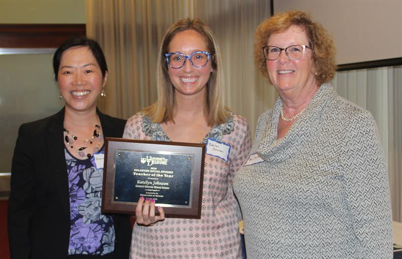 Professor Kim presented the University of Delaware Social Studies Teacher of the Year Award to Ms. Katelyn Johnson (center).